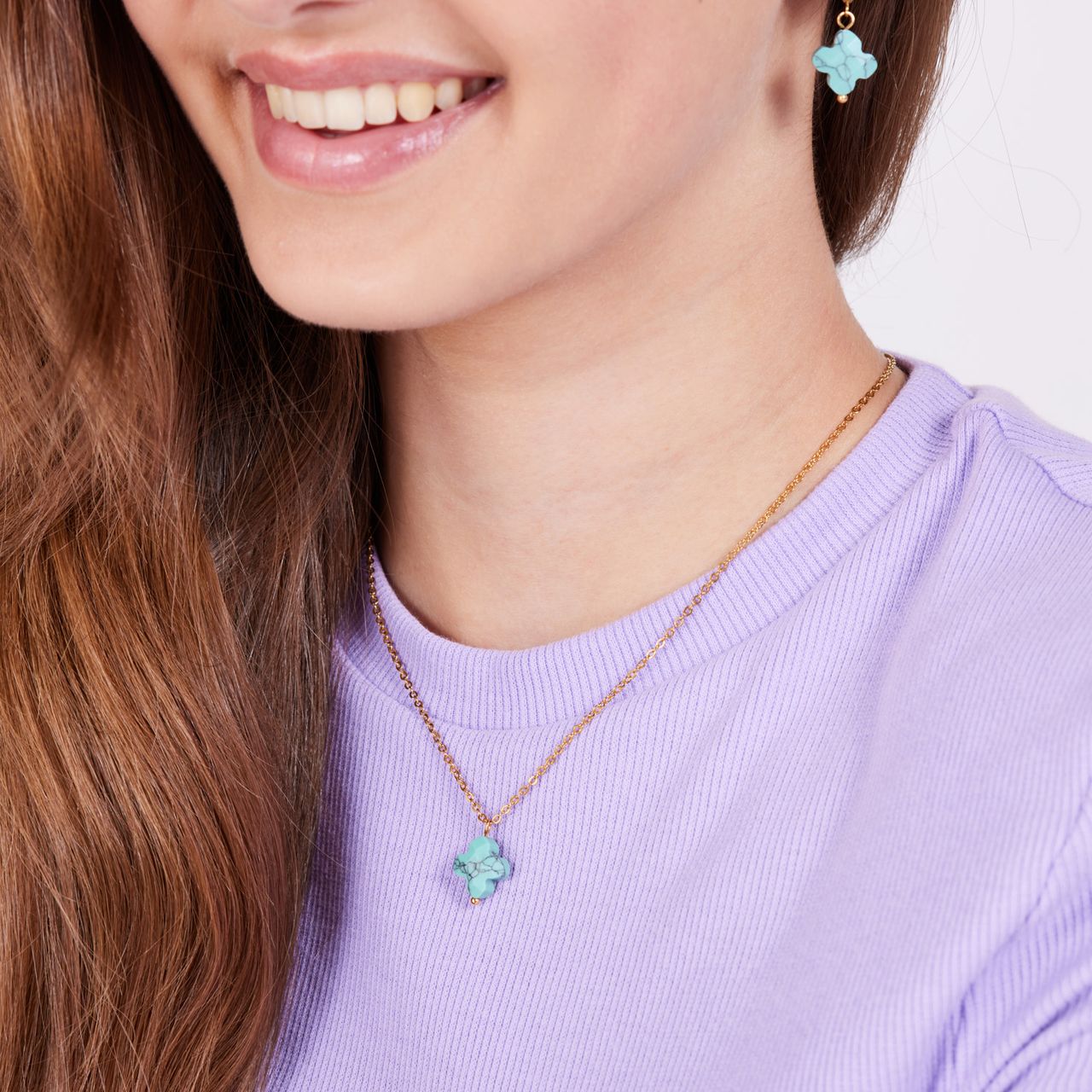Stalen goldplated ketting met hanger bloem met turquoise voor dames