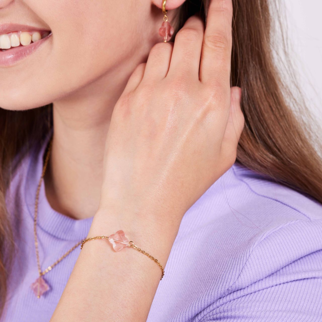 Stainless steel goldplated fantasiearmband met hanger bloem met rhodoniet voor dames