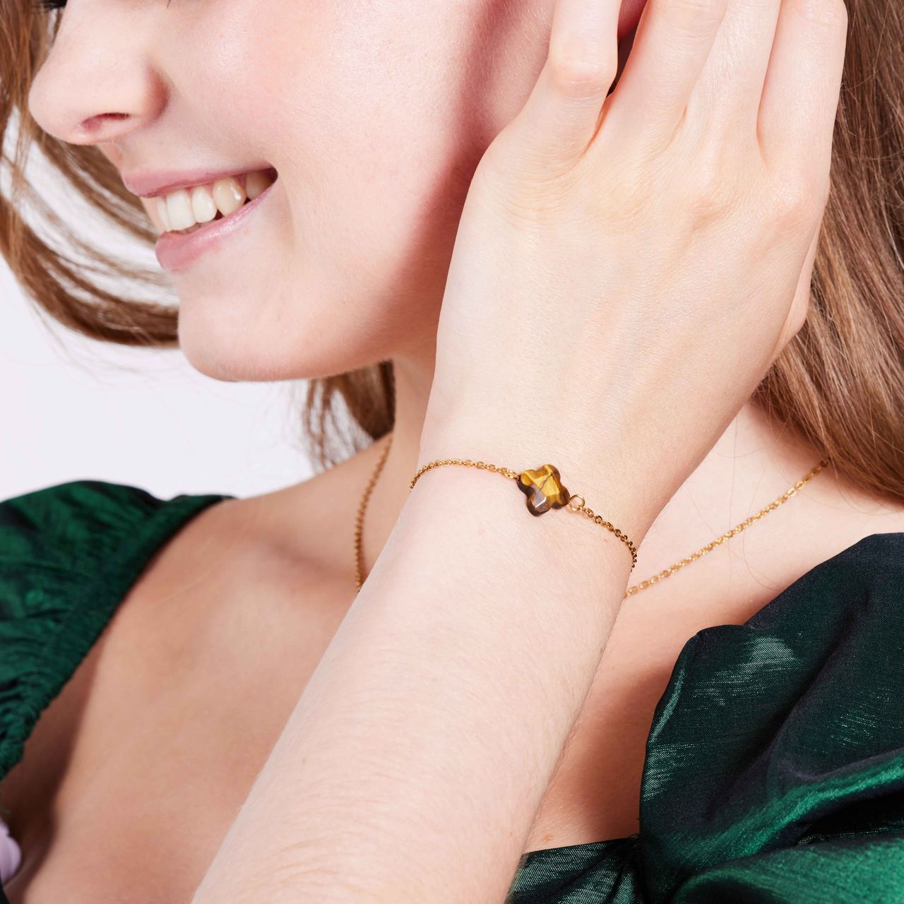 Stainless steel goldplated fantasiearmband met hanger met tijgeroog voor dames