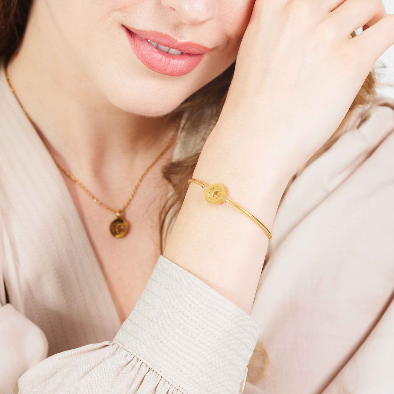 Stalen goldplated fantasiearmband met letterhanger G voor dames