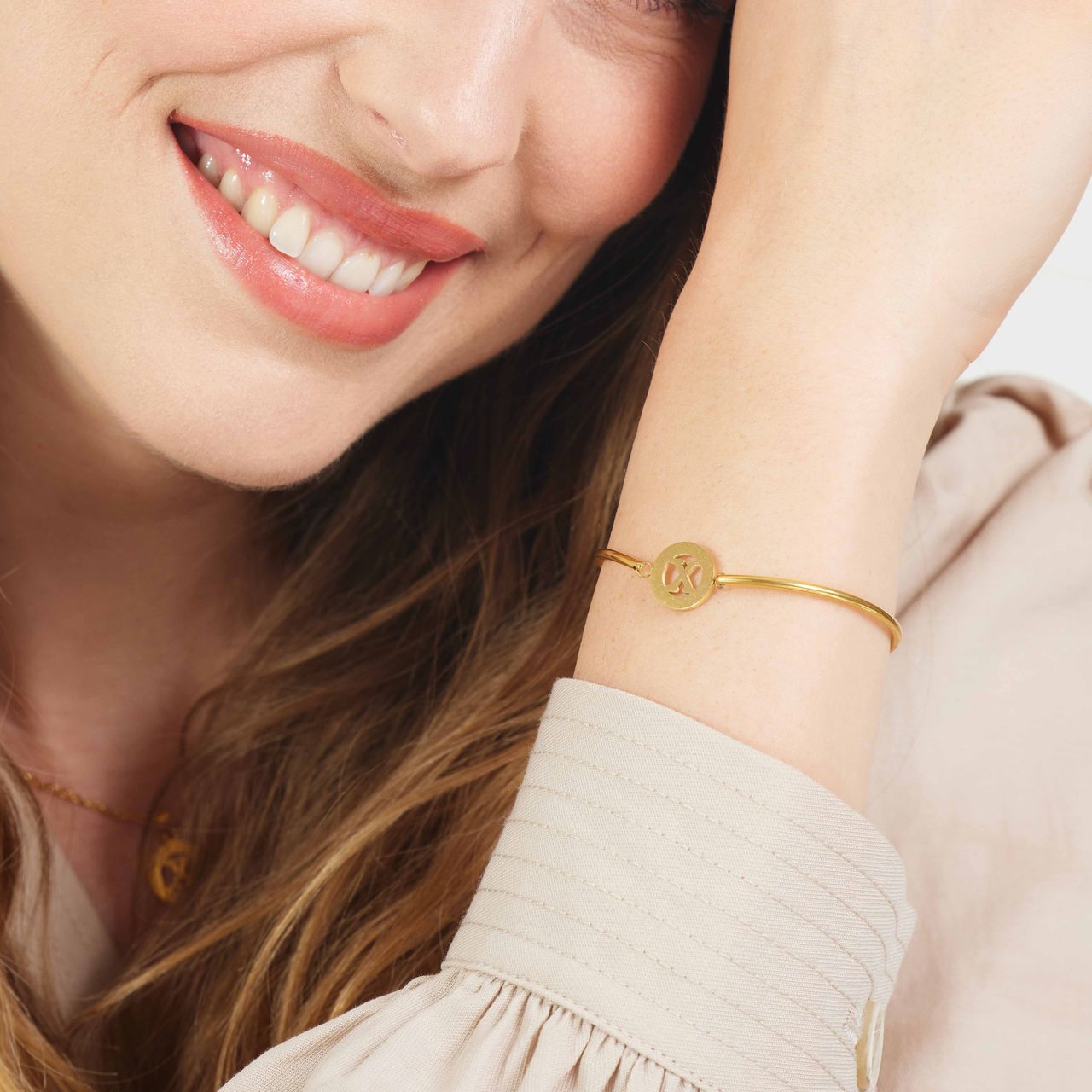 Stalen goldplated armband met letter - X