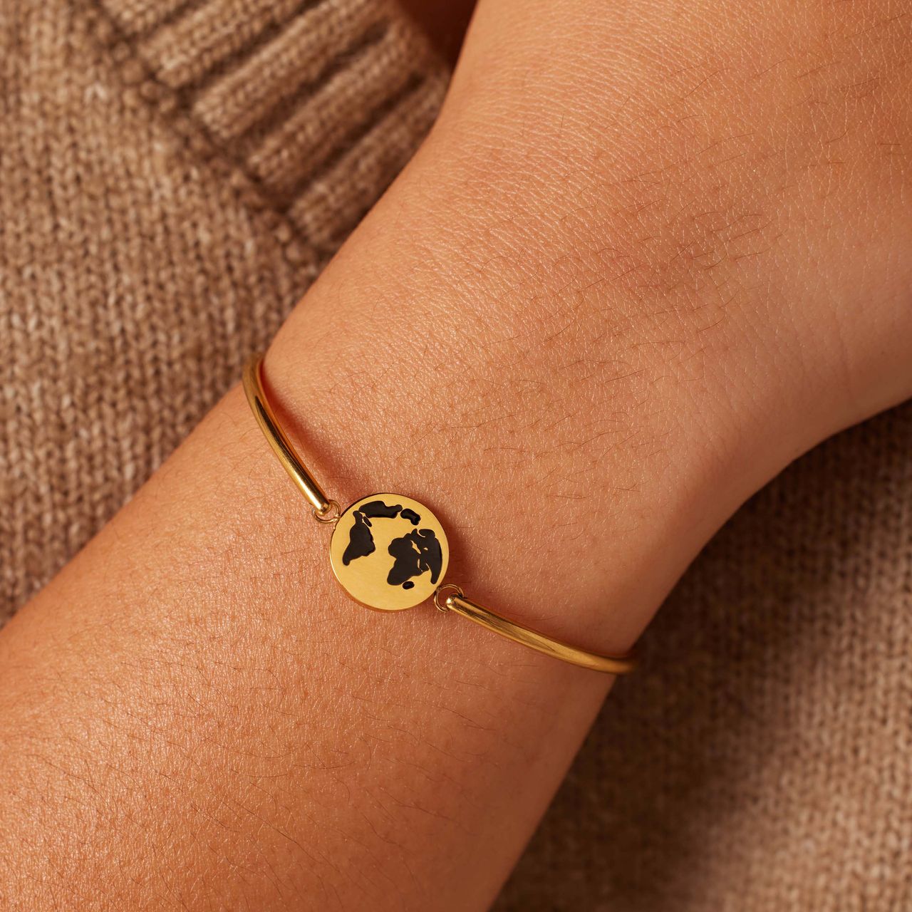 Stainless steel goldplated armband met wereldbol