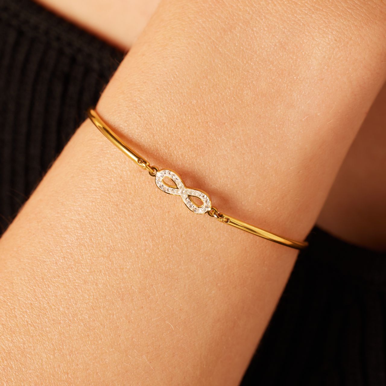 Stalen goldplated armband infinity met kristal