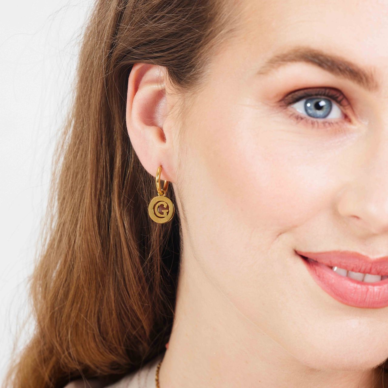 Stainless steel goldplated oorringen met letterhanger G voor dames