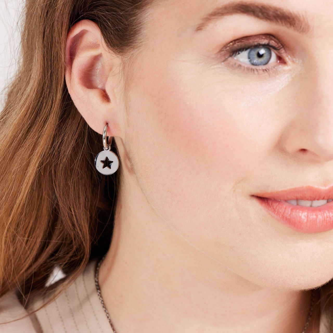 Stainless steel oorbellen met open ster