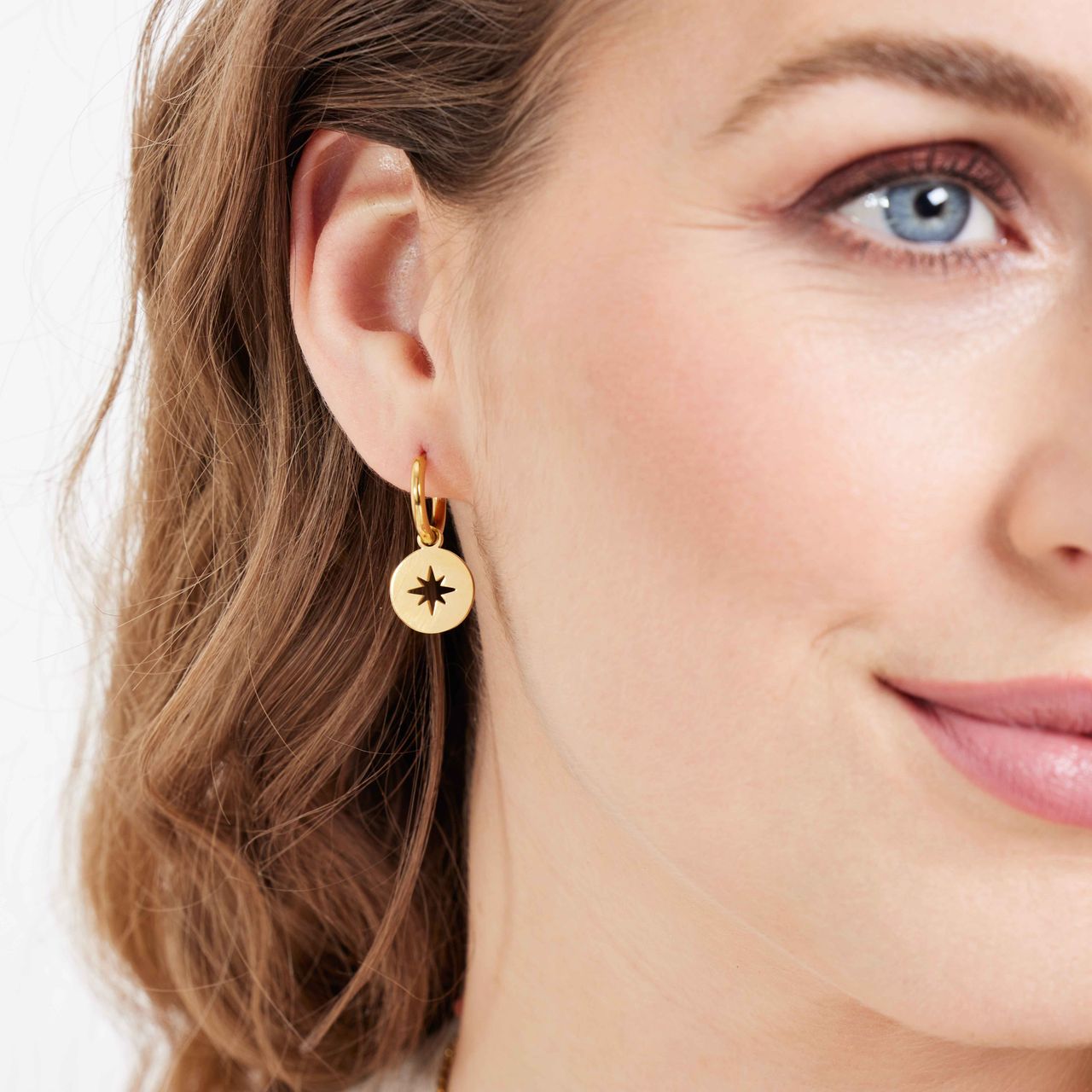 Stalen goldplated oorbellen met  Poolster