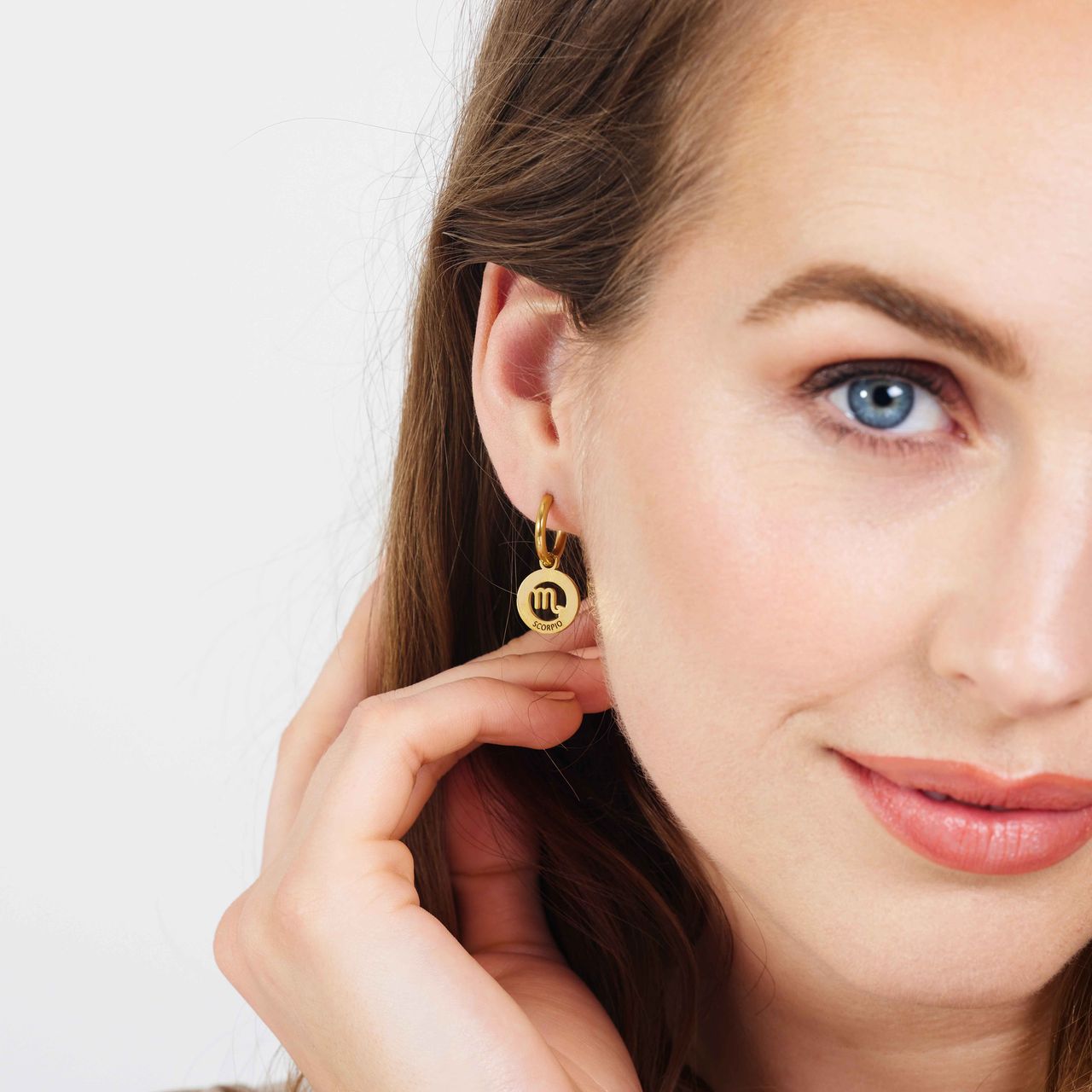 Stainless steel goldplated oorbellen met sterrenbeeld schorpioen