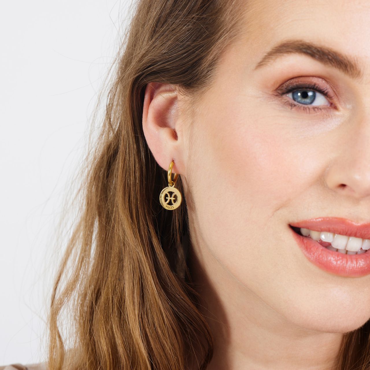 Stainless steel goldplated oorbellen met sterrenbeeld vissen
