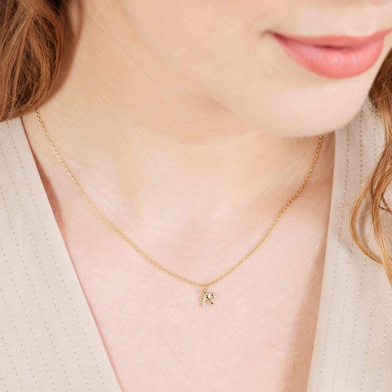 Zilveren ketting goldplated zwaluw met zirkonia