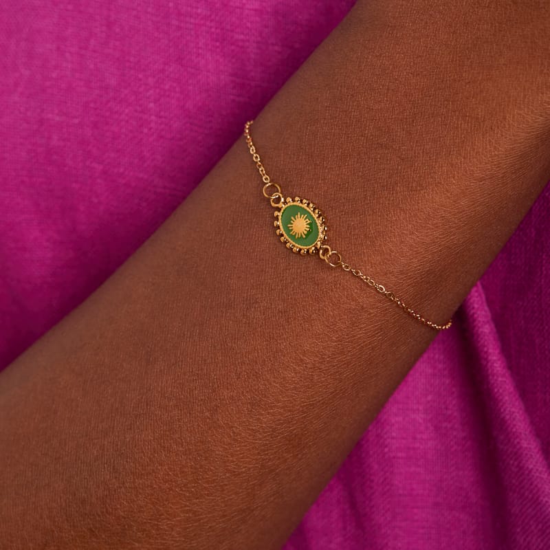 Stalen goldplated armband met groene ovale munt