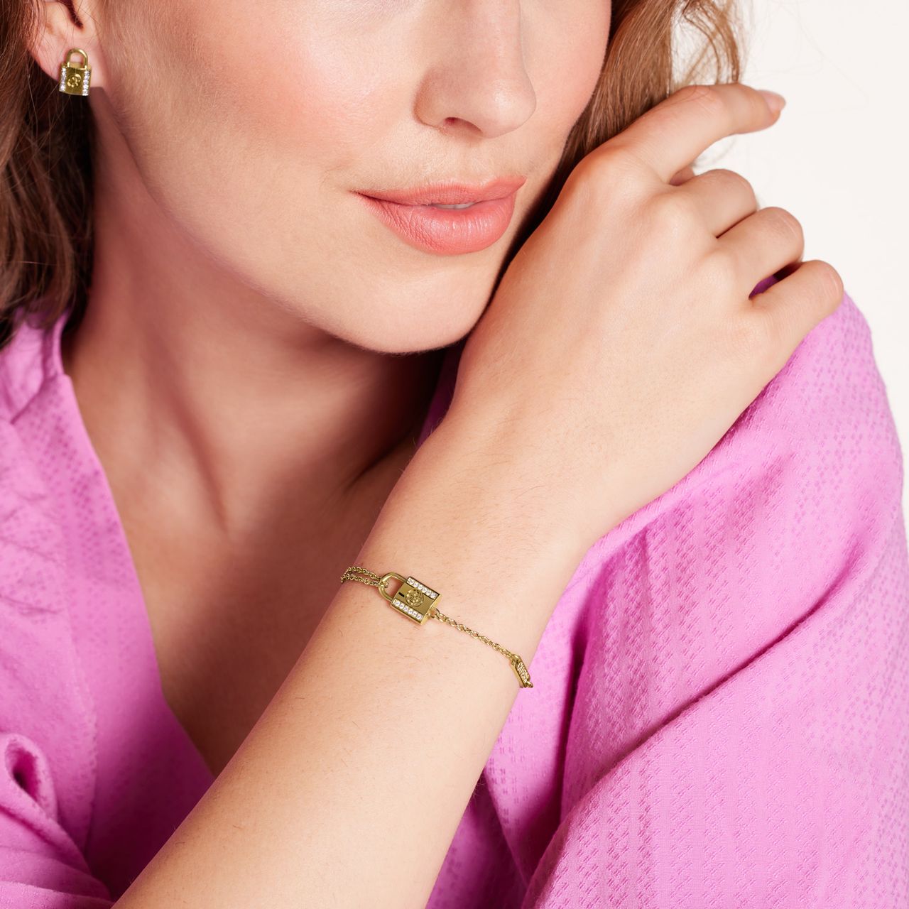 Guess stainless steel goldplated schakelarmband met kristal voor dames