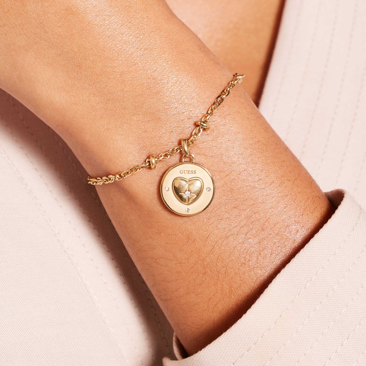 Guess stainless steel goldplated bedelarmband met kristal voor dames