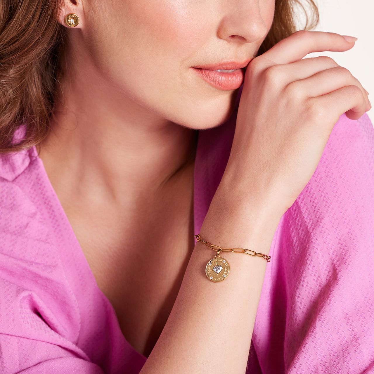 Guess stainless steel goldplated schakelarmband met kristal voor dames