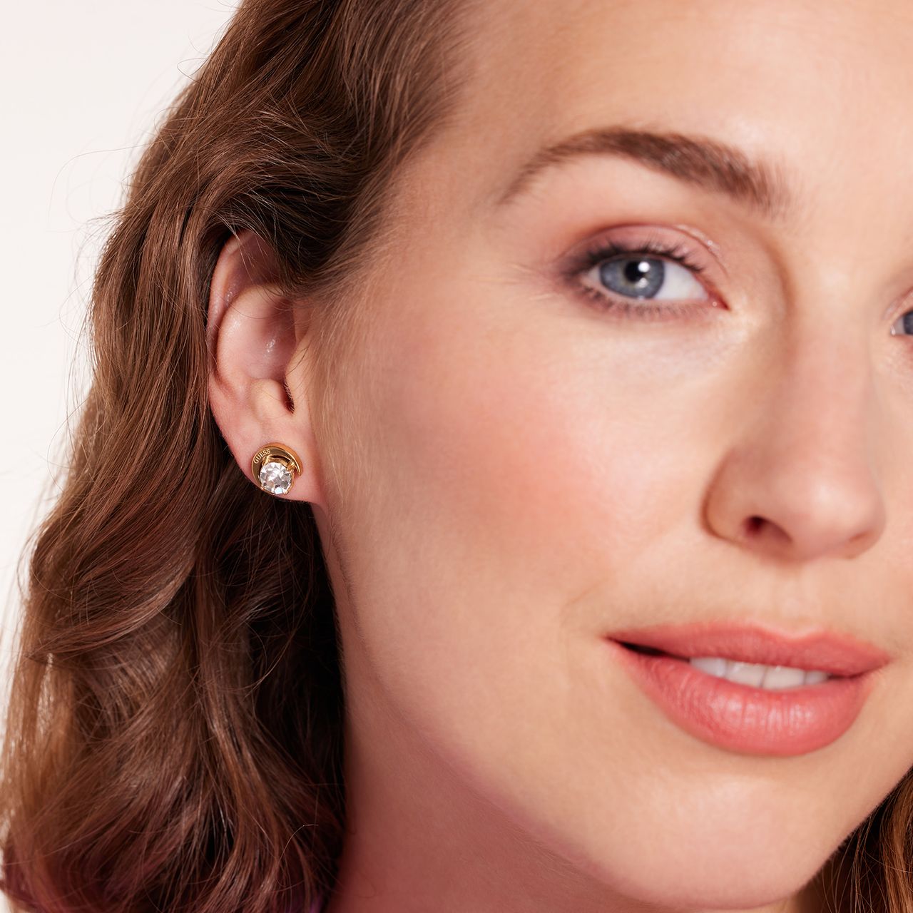 Guess stainless steel goldplated oorknoppen met kristal voor dames