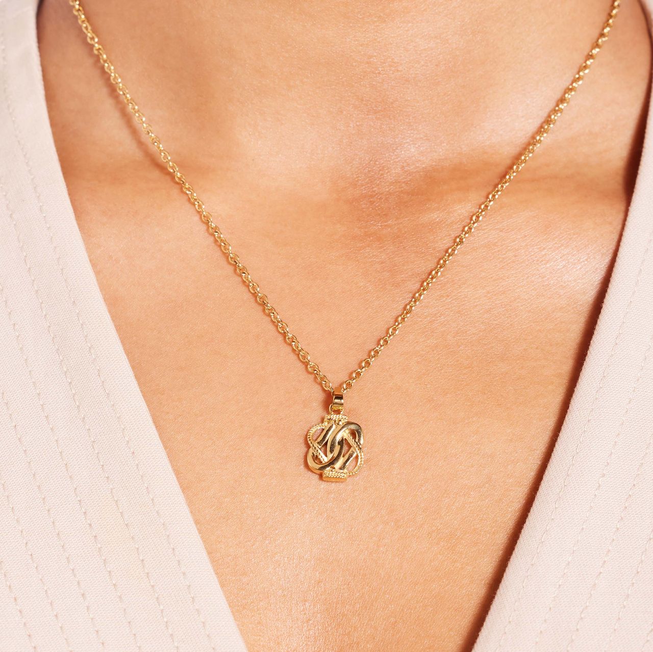 Stainless steel goldplated ketting met hanger surinaamse mattenklopper