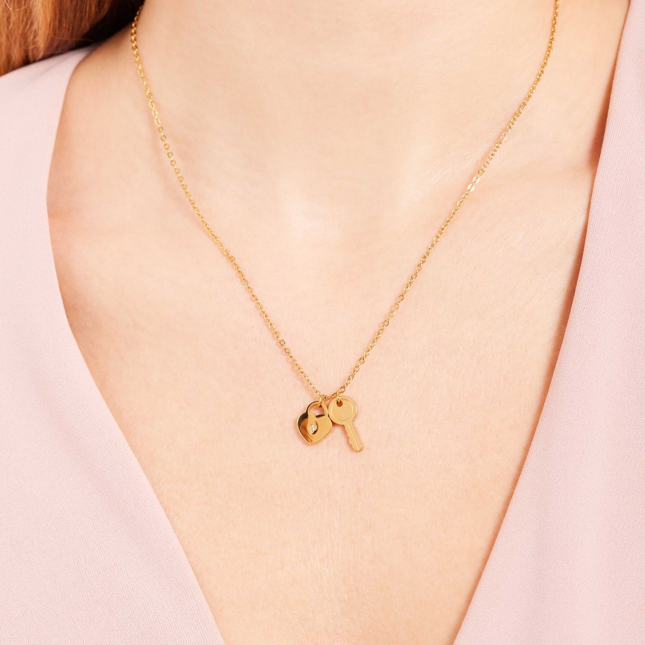 Stainless steel goldplated ketting met sleutel en hart