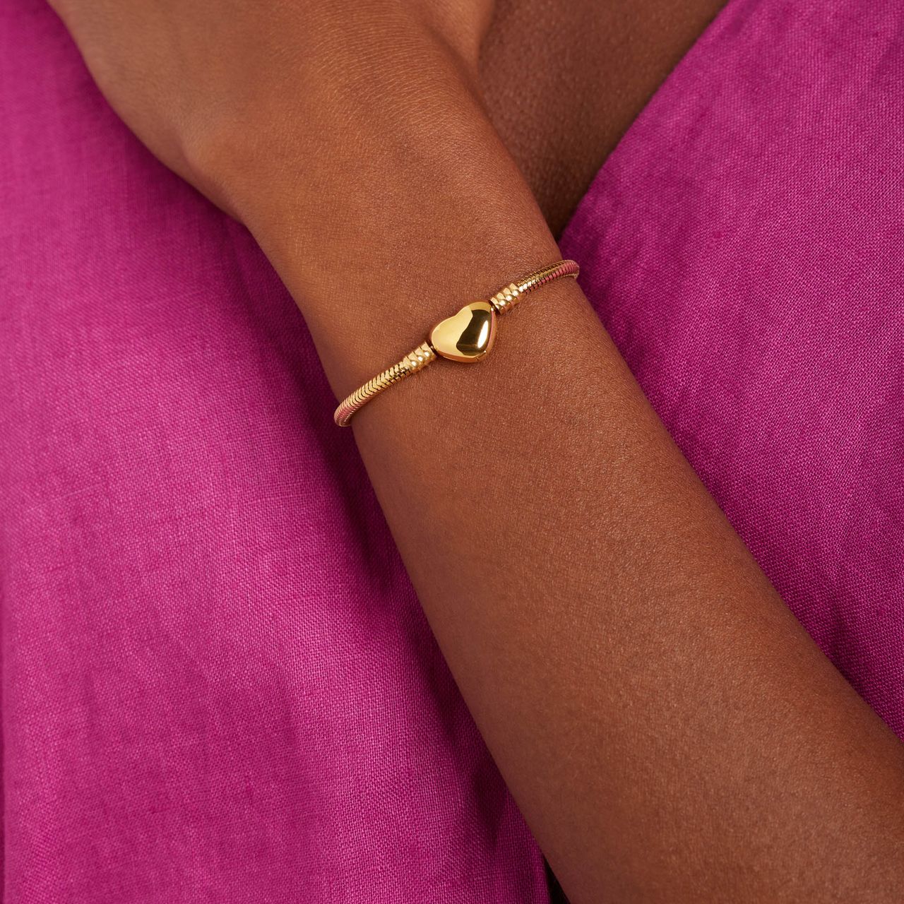 Stainless steel goldplated armband slang met hart sluiting