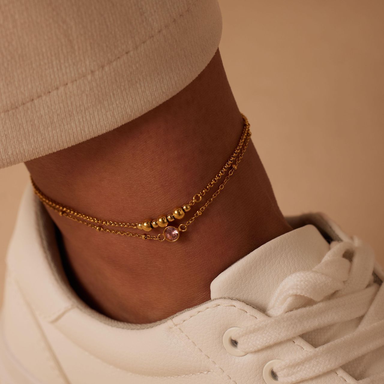 Dubbele goldplated stainless steel enkelbandje met steentje