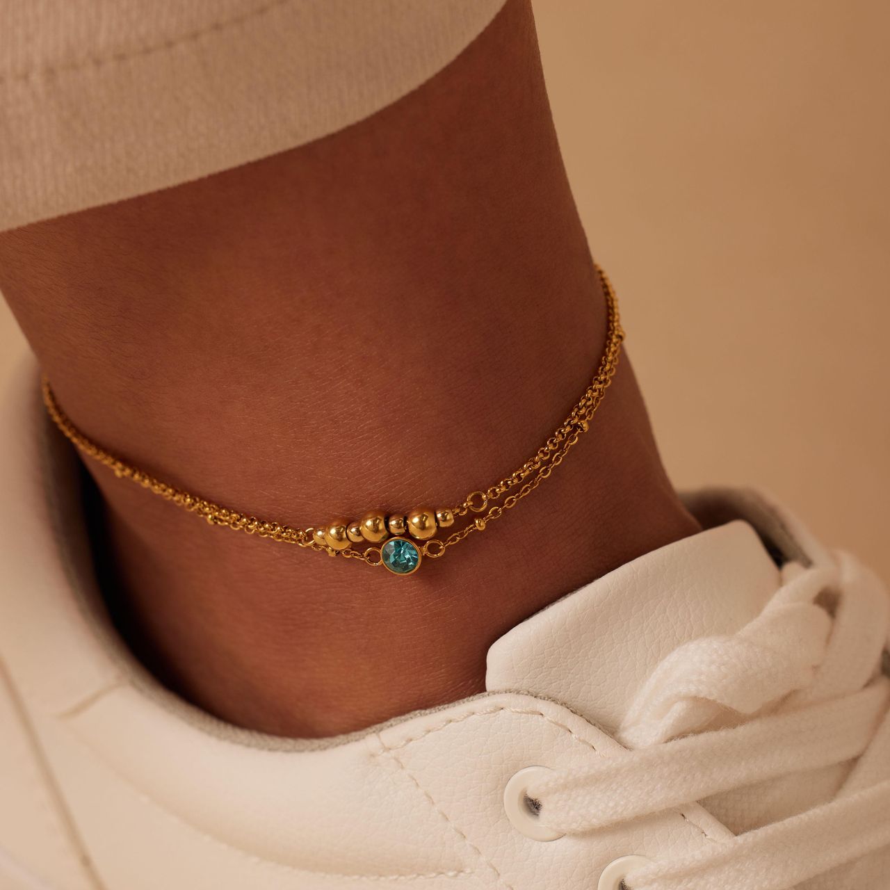 Dubbele goldplated stainless steel enkelbandje met steentje