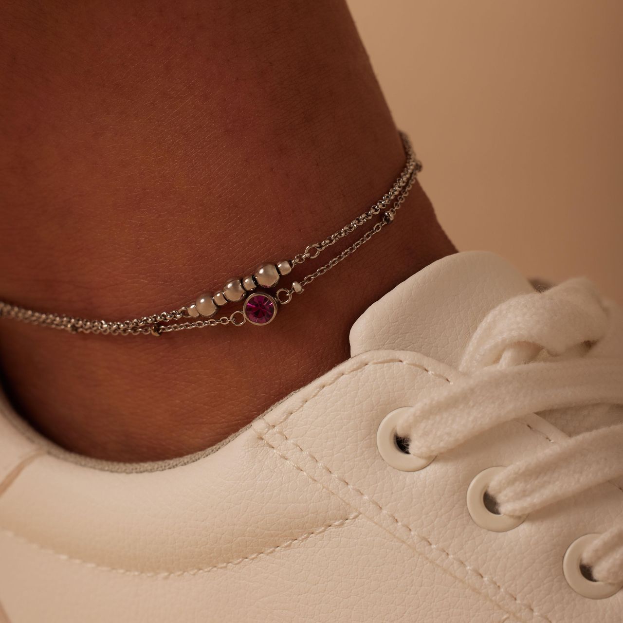 Dubbele stalen enkelbandje met fuchsia