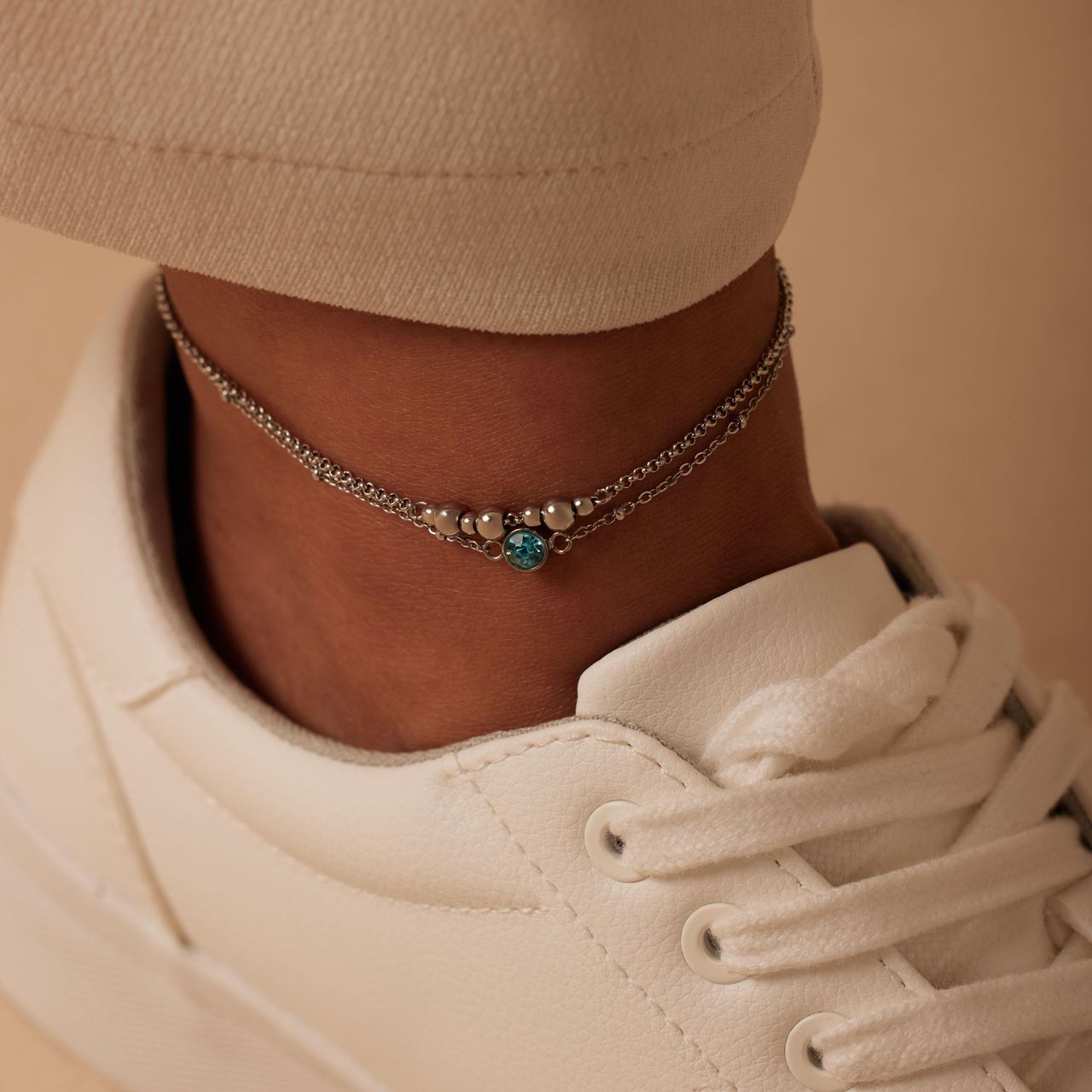 Dubbele stainless steel enkelbandje met aqua steentje