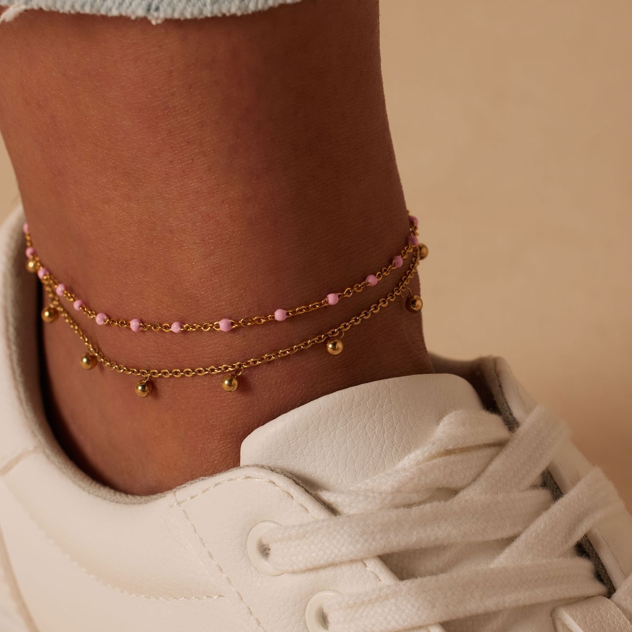 Dubbele goldplated stalen enkelband met bedeltjes