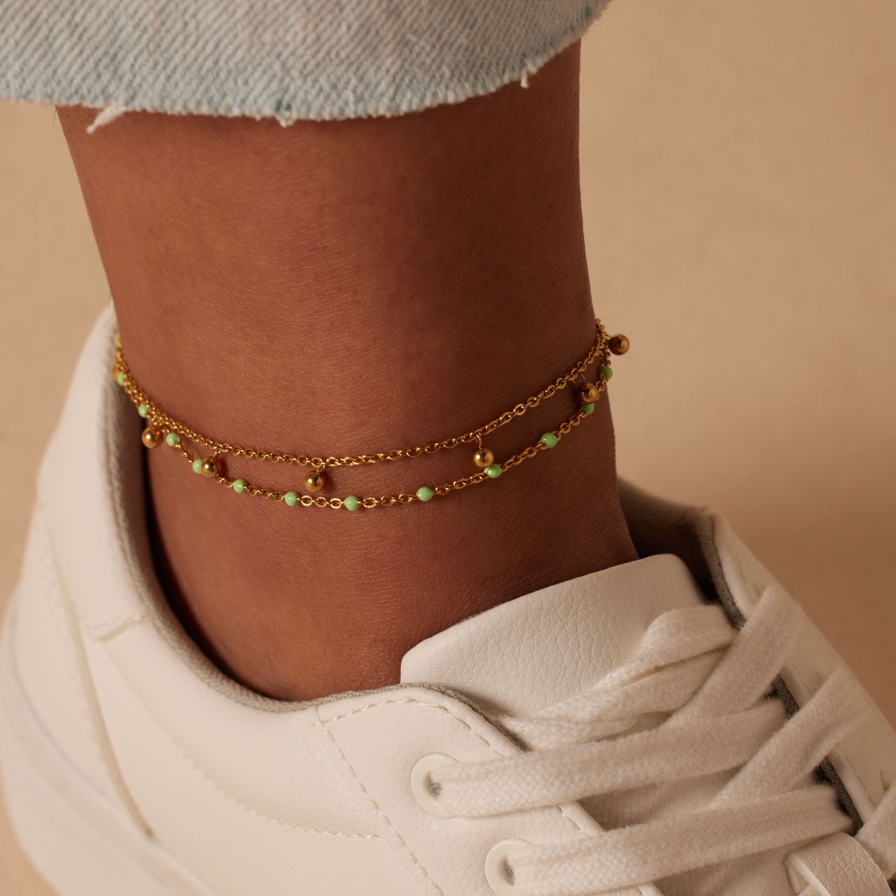 Dubbele stainless steel goldplated enkelband met bedeltjes