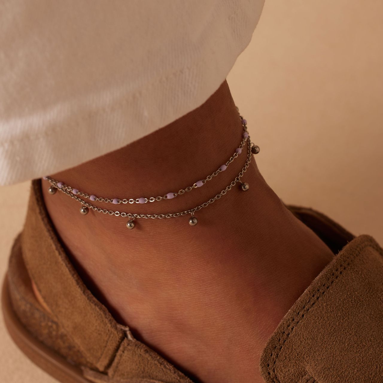 Dubbele stalen enkelband met bedeltjes