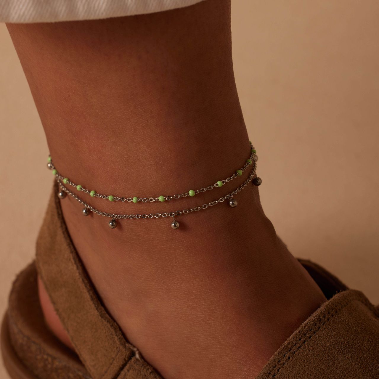 Dubbele stalen enkelband met bedeltjes