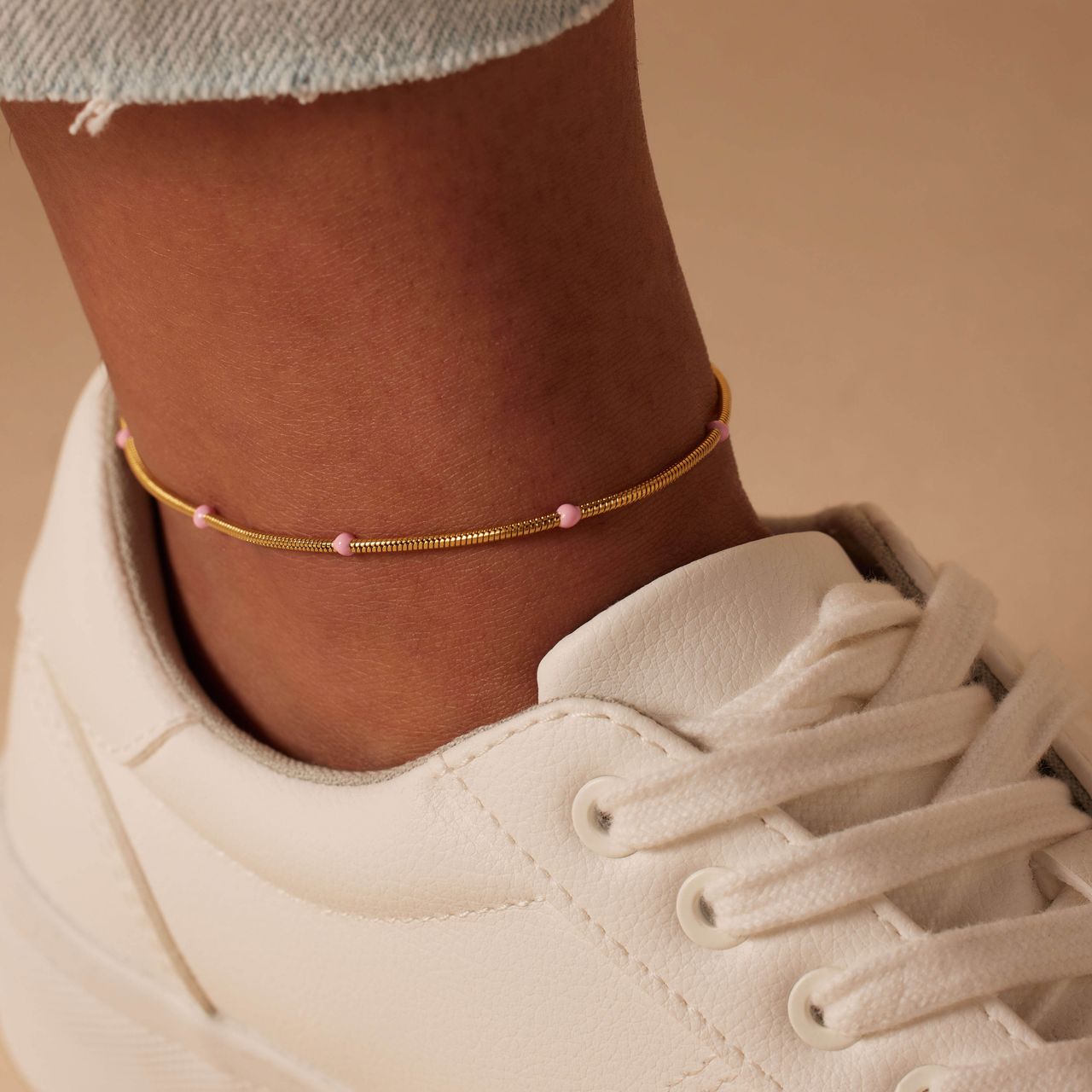 Stalen goldplated enkelband cobra lichtroze