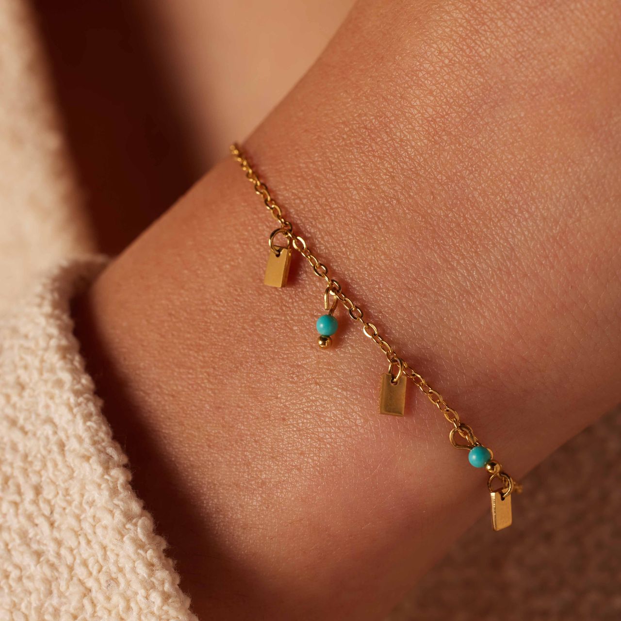 Stalen goldplated fantasiearmband met turquoise voor dames