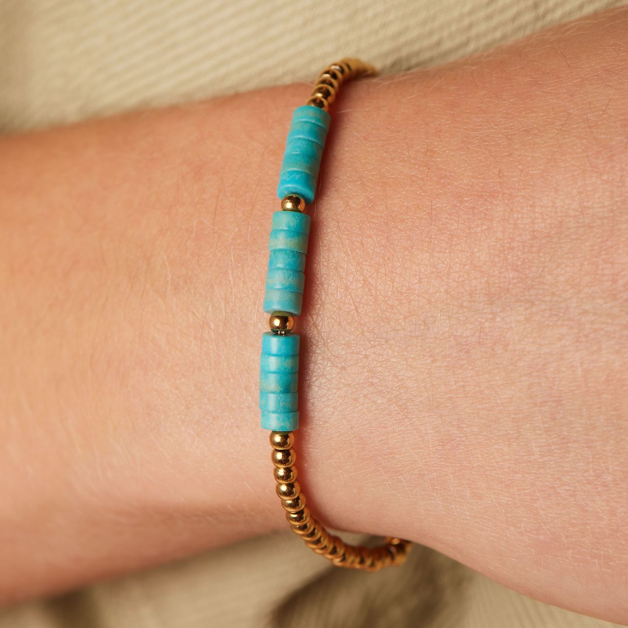 Stainless steel goldplated fantasiearmband met turquoise voor dames