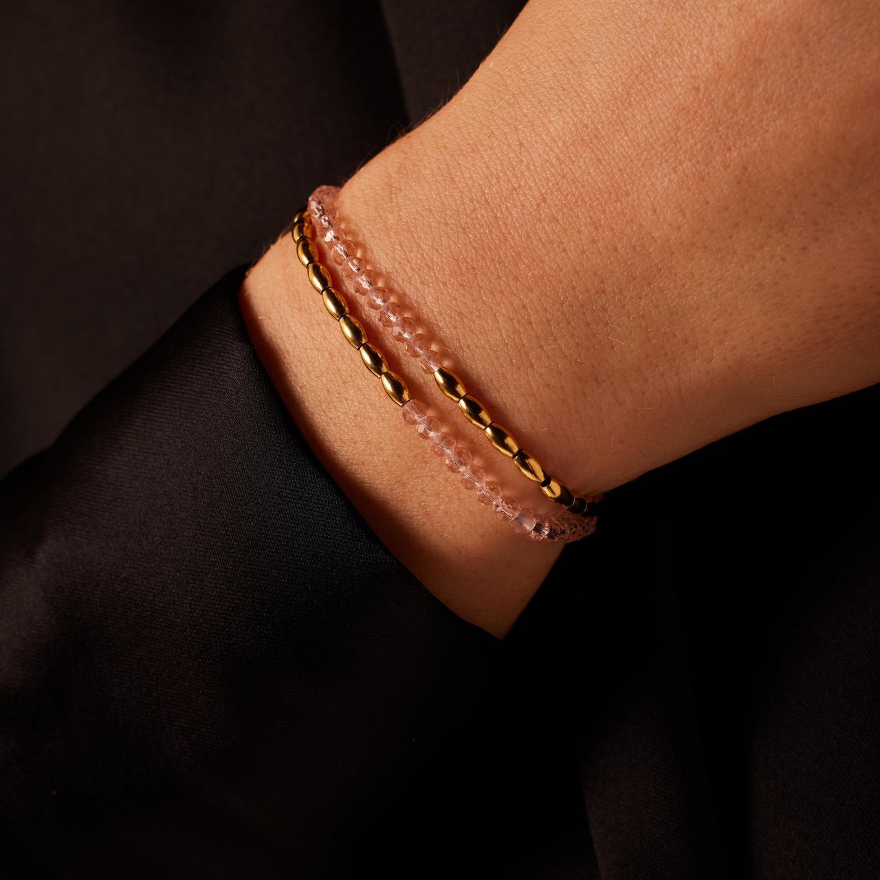 Stainless steel goldplated armband dubbel bol roze kraal
