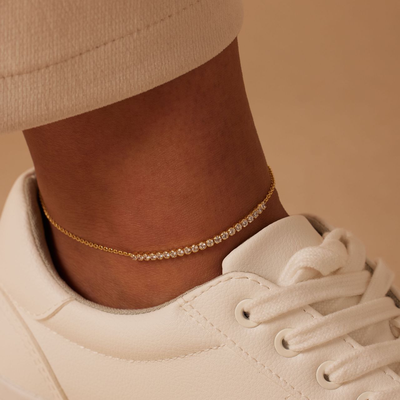 Zilveren goldpalted enkelband met zirkonia