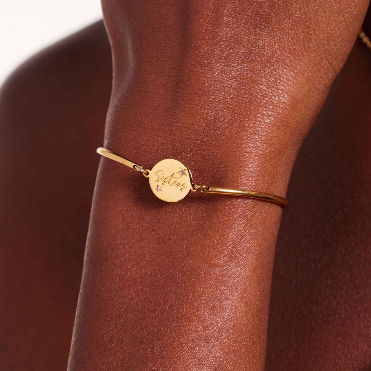 Stainless steel goldplated armband sisters