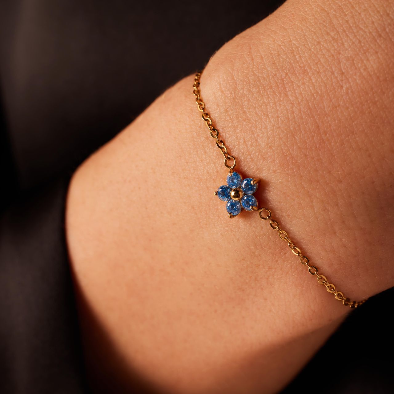 Stainless steel goldplated armband bloem met zirkonia aqua