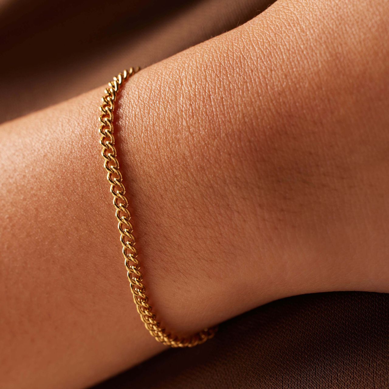 Stalen goldplated schakelarmband 3mm