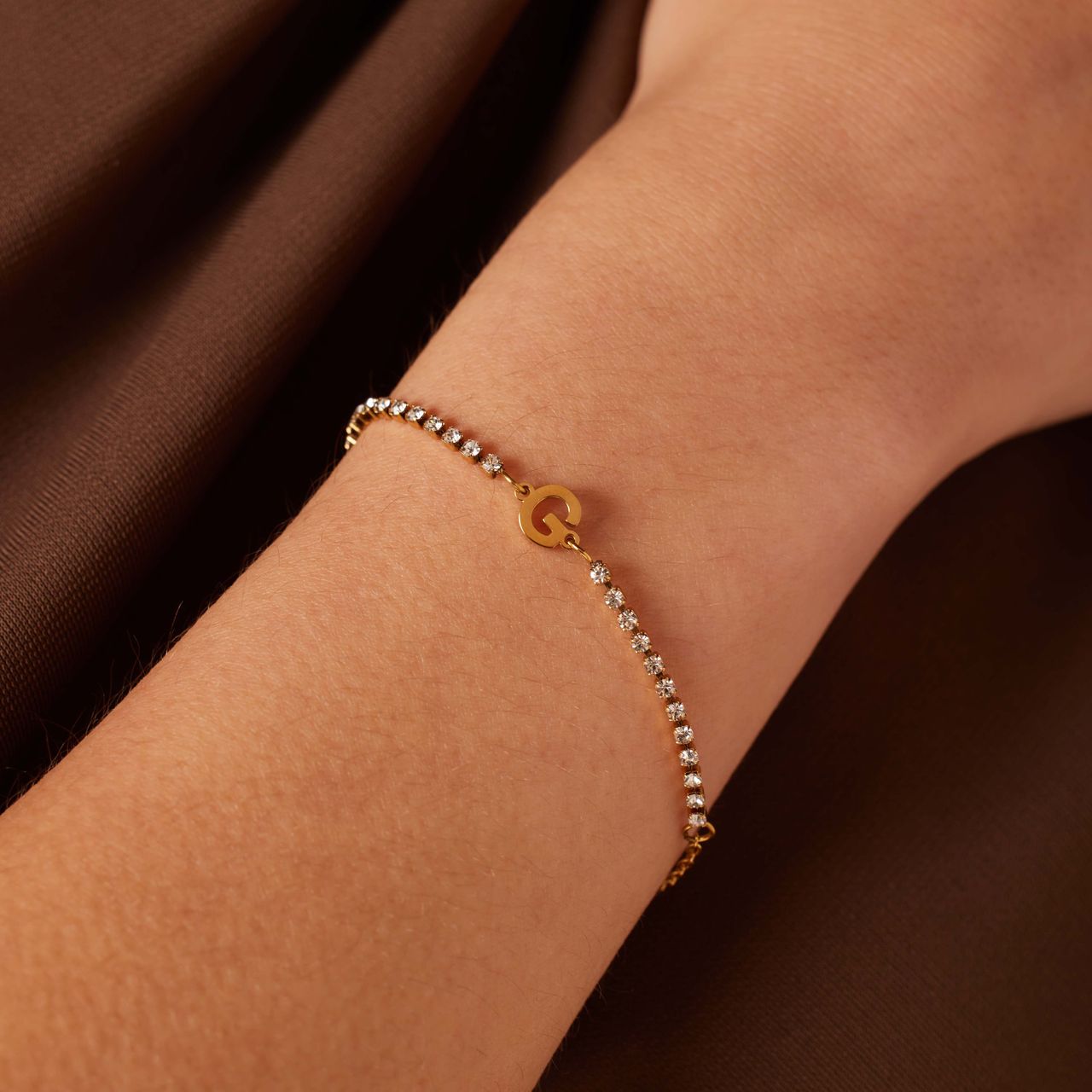 Stainless steel goldplated tennis armband wit cz letter - G