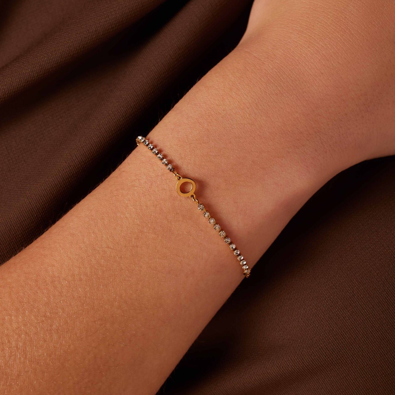 Stainless steel goldplated tennis armband wit cz letter - O