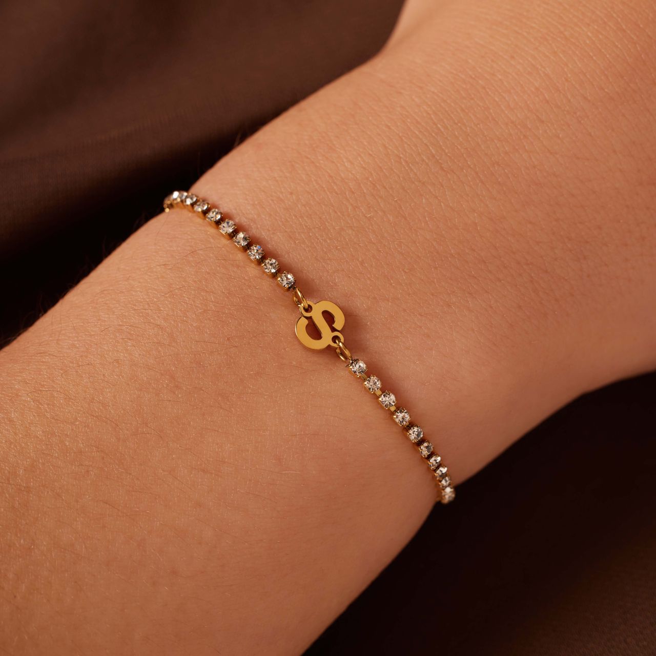 Stalen goldplated tennis armband wit cz letter - S
