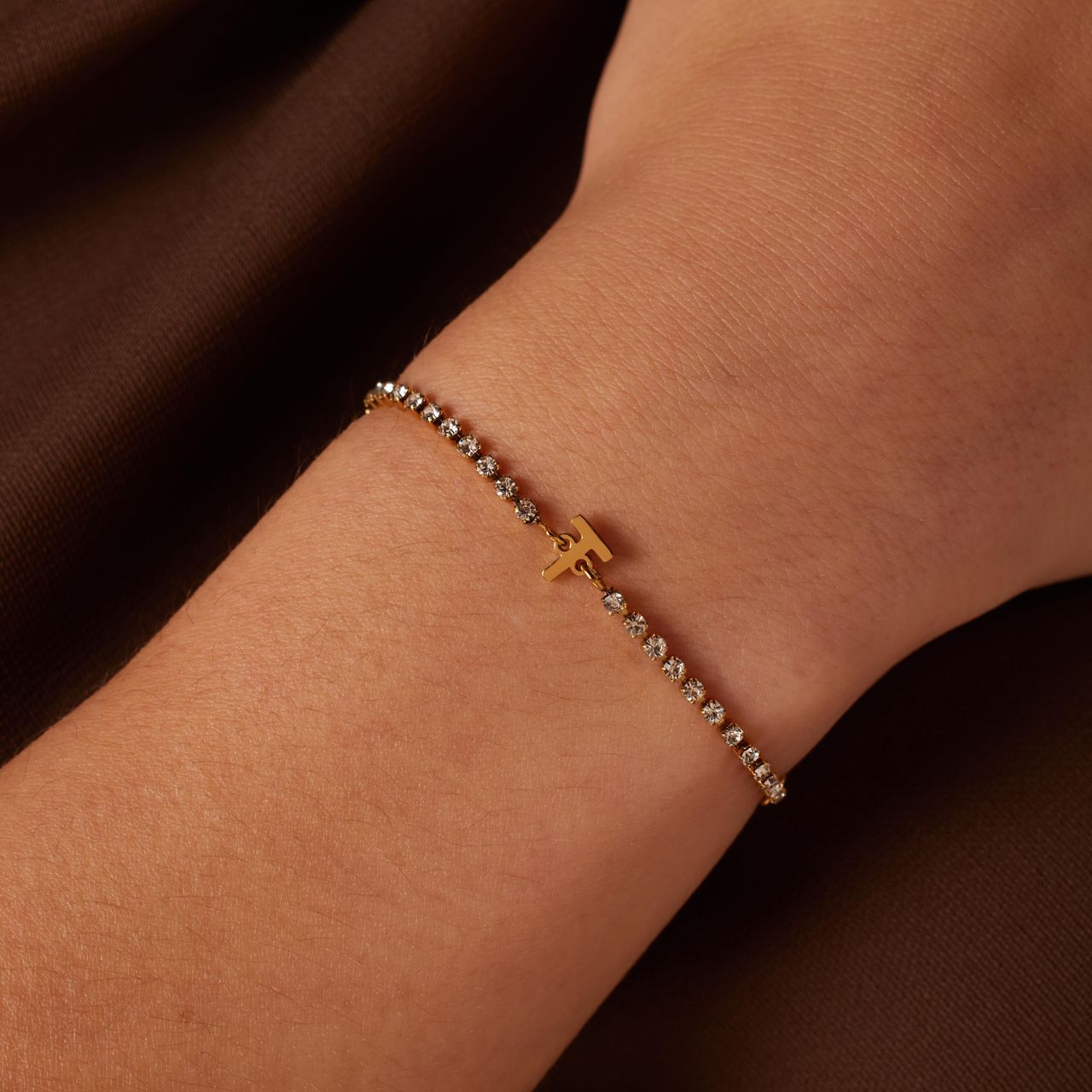 Stalen goldplated tennis armband wit cz letter - T