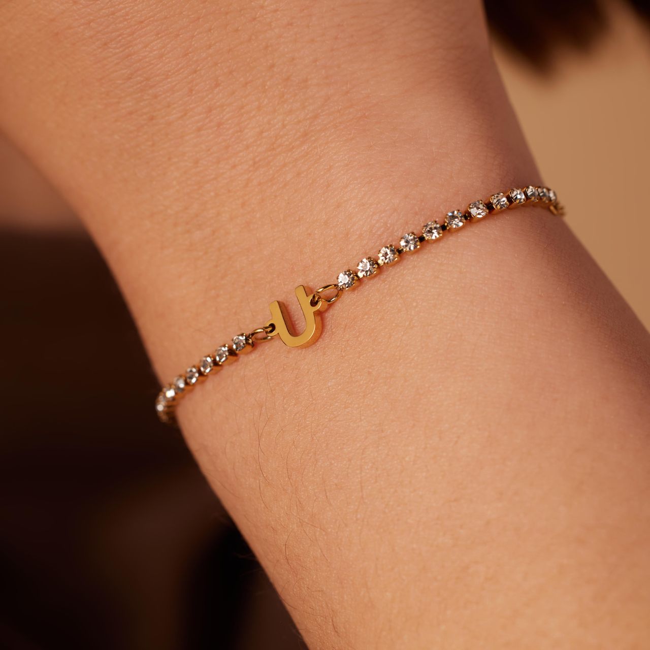 Stalen goldplated fantasiearmband met letterhanger U met zirkonia voor dames