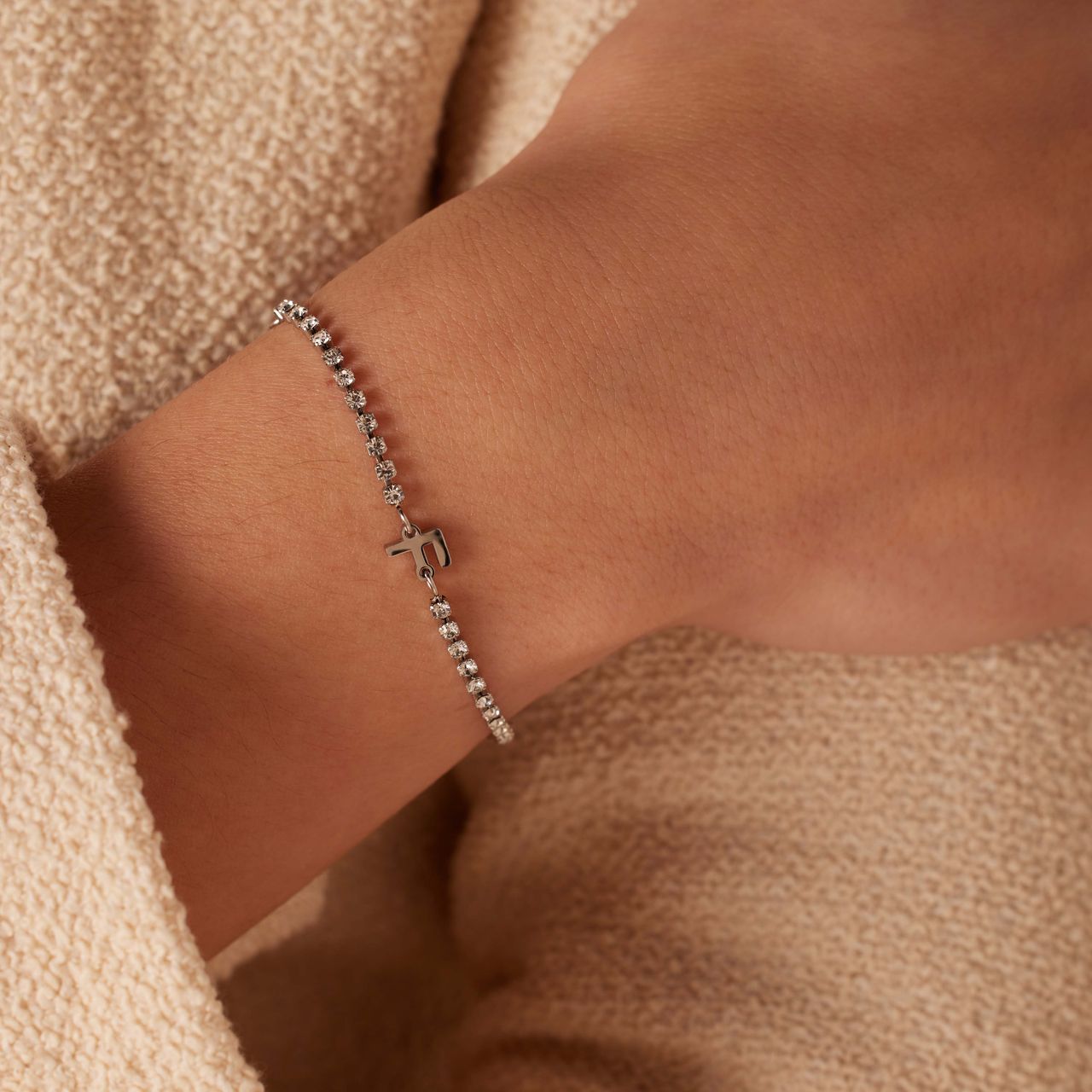 Stalen tennis armband wit cz letter - F