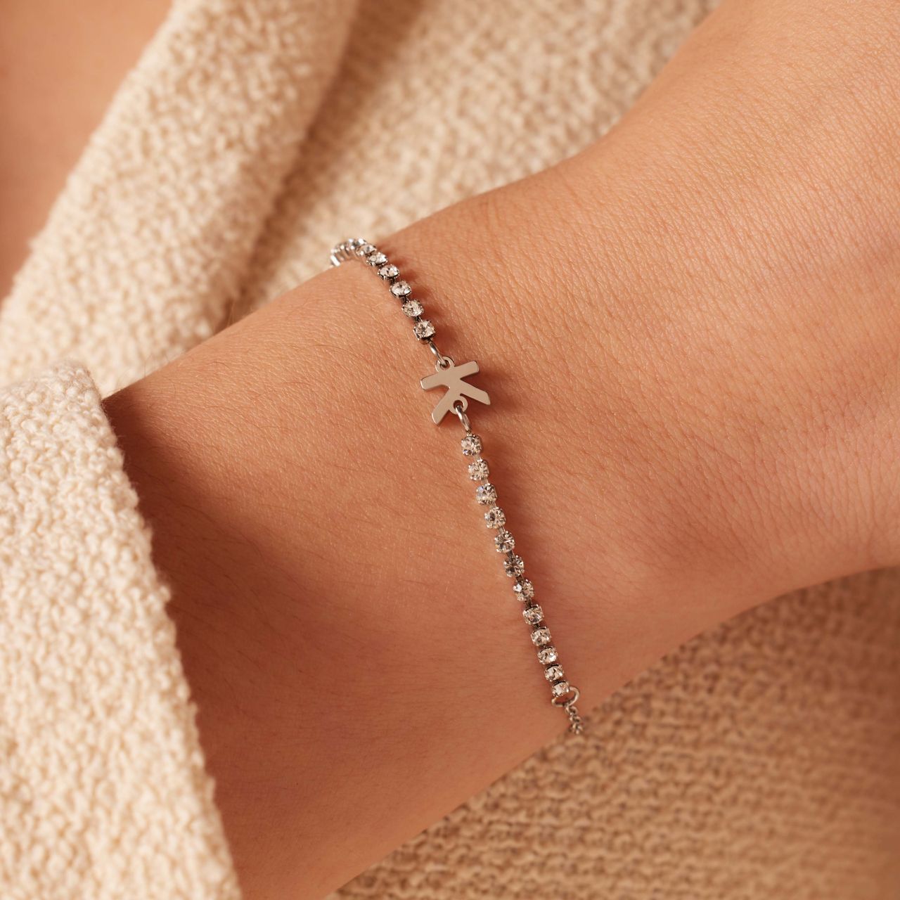 Stalen tennis armband wit cz letter - K