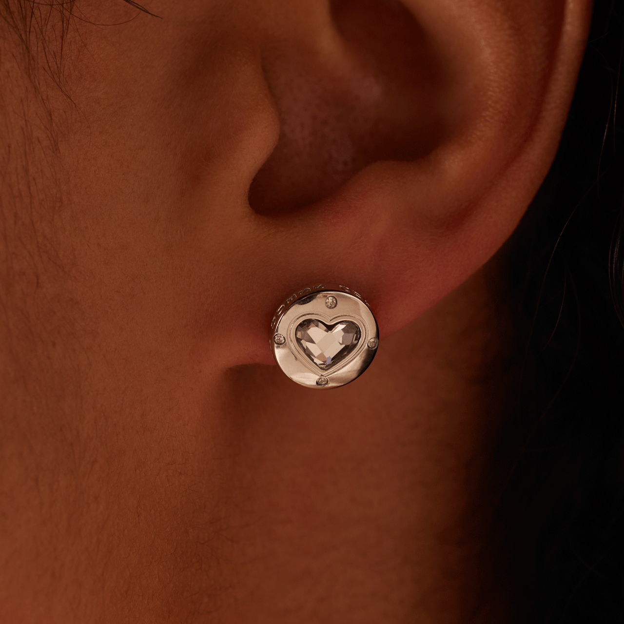 Guess stainless steel oorknoppen rolling hearts voor dames