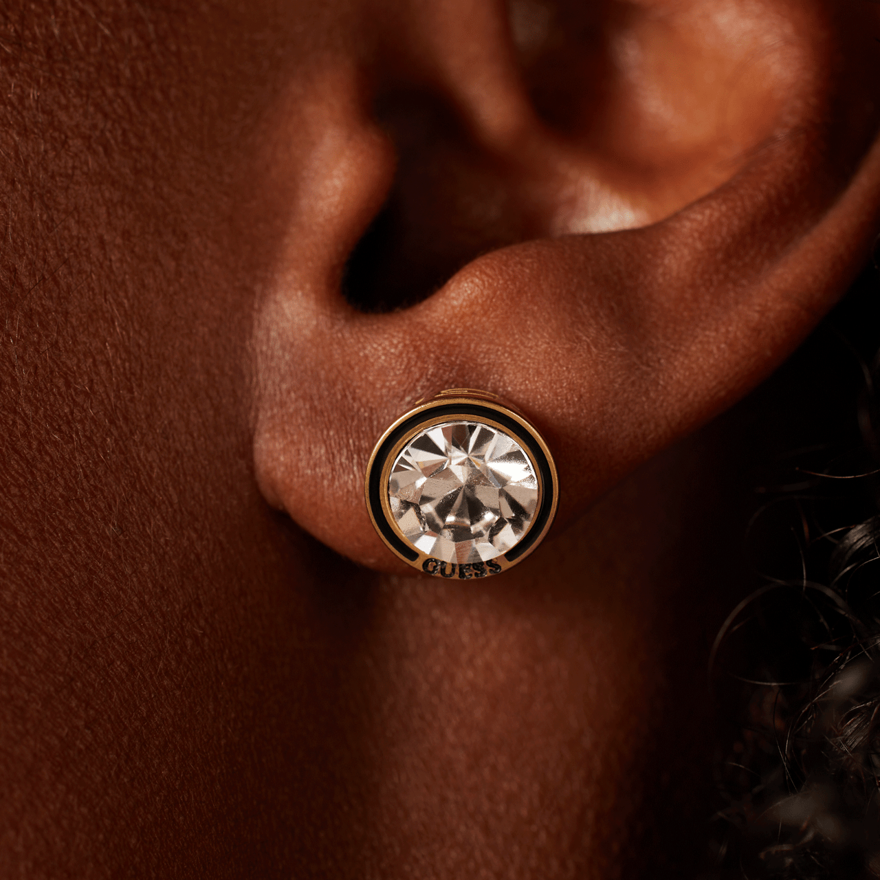 Guess stalen goldplated oorknoppen met kristal voor dames