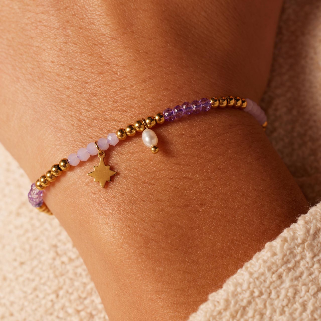 kralenarmband met parel en staal goldplated ster