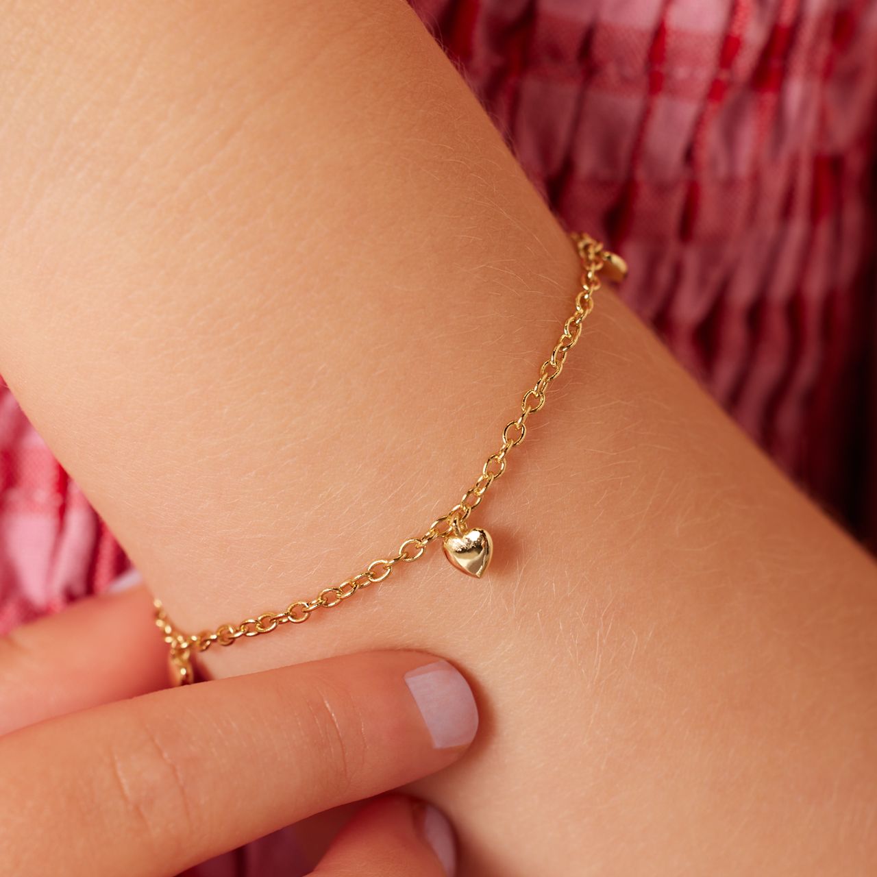 Zilveren goldplated kinderbedelarmband met hanger hart