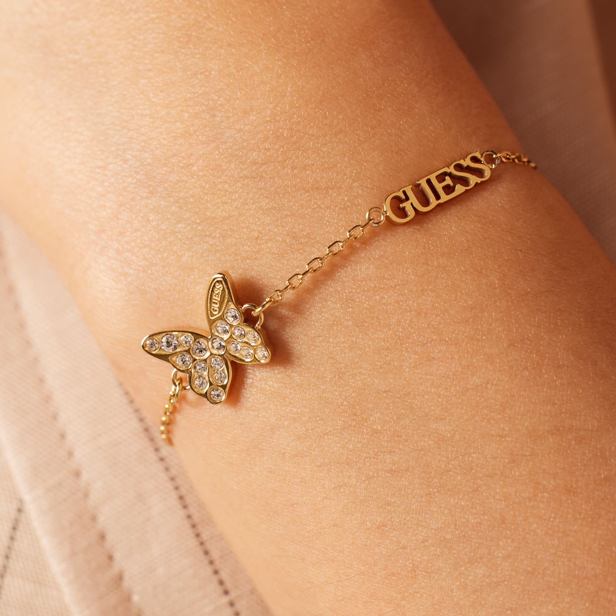 Guess Armband aus Edelstahl, vergoldet, CHRYSALIS