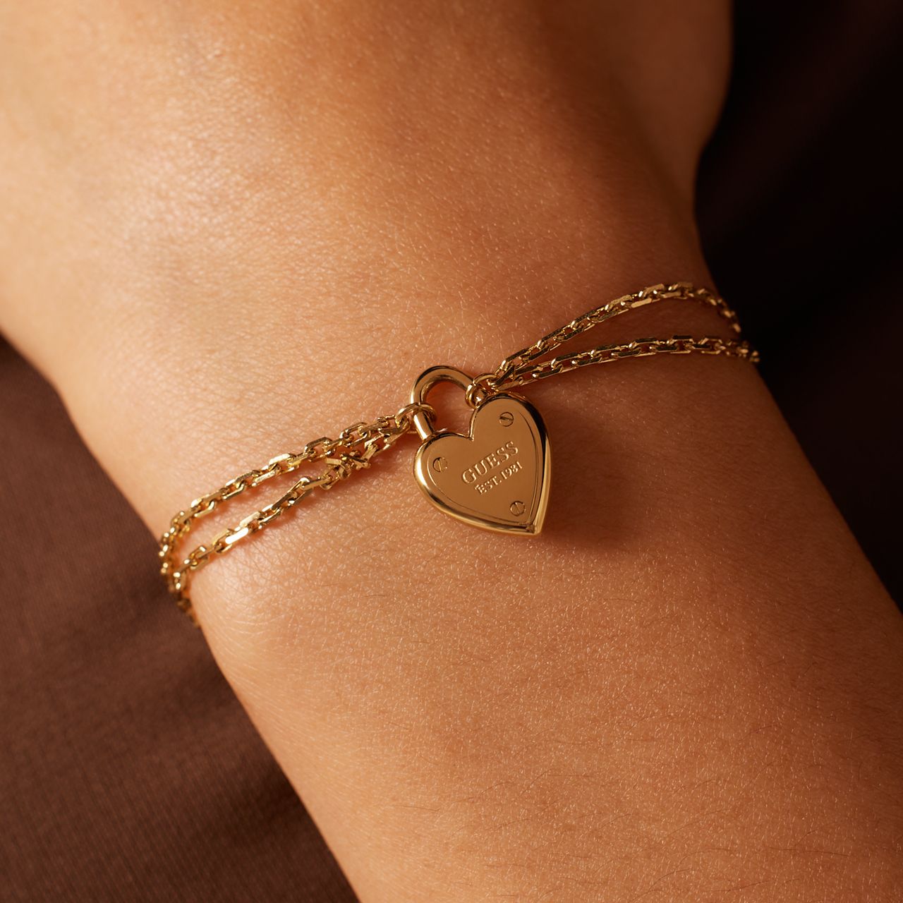 Guess stainless steel goldplated armband ALL YOU NEED IS LOVE